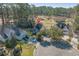 An aerial view showcases the home's location on a cul-de-sac in a wooded neighborhood at 1019 Hillsdale Dr., Little River, SC 29566