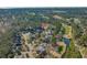 An aerial view shows the home located within a neighborhood bordering a golf course and a small pond at 1019 Hillsdale Dr., Little River, SC 29566