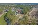 An aerial view shows the home situated within a well-treed neighborhood near a golf course at 1019 Hillsdale Dr., Little River, SC 29566
