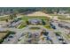 An aerial view reveals the clubhouse near a beautifully manicured golf course at 1019 Hillsdale Dr., Little River, SC 29566