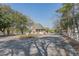 An entrance to a residential community features manicured landscaping, brick pillars, and well-maintained street at 1019 Hillsdale Dr., Little River, SC 29566