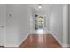 An entrance hall welcomes you with tile and hardwood floors, leading to the front door at 1019 Hillsdale Dr., Little River, SC 29566
