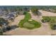 An aerial view showcases a beautifully maintained golf course within the community at 1019 Hillsdale Dr., Little River, SC 29566
