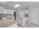 Bright kitchen with white cabinetry, island, and modern appliances offers a clean and functional space at 1019 Hillsdale Dr., Little River, SC 29566