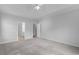 Large main bedroom with neutral carpet, and adjacent bathroom, ideal for relaxation at 1019 Hillsdale Dr., Little River, SC 29566