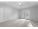 Bright, spacious main bedroom featuring neutral carpet, ceiling fan, and French doors offering abundant light at 1019 Hillsdale Dr., Little River, SC 29566
