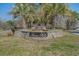 A stone sign with 'River Hills' on it is surrounded by palm trees in an attractive entrance to the neighborhood at 1019 Hillsdale Dr., Little River, SC 29566