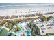 Expansive aerial view of the resort's pools, sandy beach, and oceanfront location at 1105 S Ocean Blvd. # 1106, Myrtle Beach, SC 29577