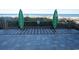 Outdoor shower with convenient access to the beach, featuring well-maintained wooden boardwalk and lush greenery at 1105 S Ocean Blvd. # 1106, Myrtle Beach, SC 29577