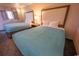 A comfortable room featuring two cozy beds, a bedside table, and soft lighting for a relaxing and peaceful ambiance at 1105 S Ocean Blvd. # 1106, Myrtle Beach, SC 29577