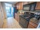 Kitchen featuring modern appliances, wooden cabinetry, and granite countertops, open to a dining area with an ocean view at 1105 S Ocean Blvd. # 1106, Myrtle Beach, SC 29577