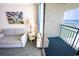Cozy living room area with access to a private balcony and ocean views at 1105 S Ocean Blvd. # 1106, Myrtle Beach, SC 29577