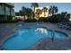 Multi-level pool area with a variety of depths for all ages, surrounded by comfortable lounge chairs and tropical foliage at 1105 S Ocean Blvd. # 1106, Myrtle Beach, SC 29577