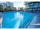 Large outdoor pool with clear blue water, surrounding lounge chairs, and palm trees, creating a resort-like atmosphere at 1105 S Ocean Blvd. # 1106, Myrtle Beach, SC 29577