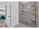 Modern bathroom features a tiled shower with a glass door and built-in shelving at 119 Gully Branch Dr. # 4, Myrtle Beach, SC 29572