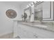 Elegant bathroom featuring dual sinks, granite countertops, and decorative mirrors at 119 Gully Branch Dr. # 4, Myrtle Beach, SC 29572