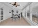 Bright dining area with view of multiple windows, a glass table, and white chairs at 119 Gully Branch Dr. # 4, Myrtle Beach, SC 29572