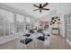 Bright dining area featuring a glass table, white chairs, and a view of the outdoor patio at 119 Gully Branch Dr. # 4, Myrtle Beach, SC 29572