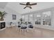 Bright dining area with white furniture set, fireplace, and natural light from the large windows at 119 Gully Branch Dr. # 4, Myrtle Beach, SC 29572