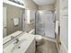 Bright bathroom with a white vanity, toilet, and a glass-enclosed shower at 601 Hillside Dr. N # 4535, North Myrtle Beach, SC 29582