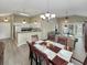 Open-concept dining area adjacent to a fully equipped kitchen and spacious living room at 601 Hillside Dr. N # 4535, North Myrtle Beach, SC 29582