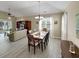 Bright dining room featuring a wooden table with seating for six and abundant natural light from a large window at 601 Hillside Dr. N # 4535, North Myrtle Beach, SC 29582