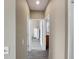 Hallway features neutral paint and modern vinyl floors leading to other rooms at 601 Hillside Dr. N # 4535, North Myrtle Beach, SC 29582