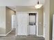 Convenient laundry closet with a stacked washer and dryer unit at 601 Hillside Dr. N # 4535, North Myrtle Beach, SC 29582