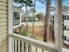 Relaxing view from a screened-in porch overlooking the community pool surrounded by lush greenery and well-maintained buildings at 601 Hillside Dr. N # 4535, North Myrtle Beach, SC 29582