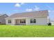 Spacious backyard featuring a well-manicured lawn and a rear patio with access to the home at 632 Woodside Dr., Conway, SC 29526