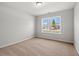 Bright, neutral bedroom features a large window providing plenty of natural light at 632 Woodside Dr., Conway, SC 29526