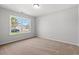 Empty bedroom with carpet, neutral walls, a window, and electrical outlets at 632 Woodside Dr., Conway, SC 29526
