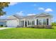 Inviting exterior showcasing a well-maintained lawn, attached garage, and attractive architectural details at 632 Woodside Dr., Conway, SC 29526