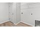 Laundry room with white door, hardwood floors, and wall connections at 632 Woodside Dr., Conway, SC 29526