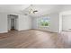 Sunlit living room with hard wood floors, ceiling fan, and windows providing ample natural light at 632 Woodside Dr., Conway, SC 29526