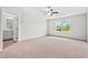 Large main bedroom with ensuite bath, carpet, ceiling fan and large window at 632 Woodside Dr., Conway, SC 29526