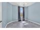 Serene bedroom with blue walls, light grey floors and a window with blackout curtains at 725 Salerno Circle # A, Myrtle Beach, SC 29579