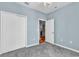 Bedroom with blue walls, light grey floors and open doorway to another room in the house at 725 Salerno Circle # A, Myrtle Beach, SC 29579