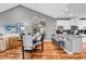 Open concept dining room featuring hardwood floors, a chandelier and breakfast bar at 725 Salerno Circle # A, Myrtle Beach, SC 29579