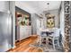 Cozy dining area features hardwood floors, stylish lighting, and elegant decor at 725 Salerno Circle # A, Myrtle Beach, SC 29579