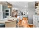 Open-concept dining area featuring hardwood floors, stylish lighting, and seamless flow to the kitchen at 725 Salerno Circle # A, Myrtle Beach, SC 29579