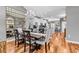 Elegant dining room with chandelier, large mirror and wood floors next to an open kitchen at 725 Salerno Circle # A, Myrtle Beach, SC 29579