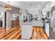 Bright and airy kitchen featuring white cabinetry, hardwood floors, granite countertops, and stainless steel appliances at 725 Salerno Circle # A, Myrtle Beach, SC 29579