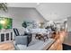 Cozy living room with vaulted ceiling, plush seating, and stylish decor flowing into dining area at 725 Salerno Circle # A, Myrtle Beach, SC 29579