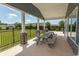 Relaxing covered patio with a picnic table and views of the community green space, perfect for outdoor gatherings at 725 Salerno Circle # A, Myrtle Beach, SC 29579