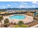 Stunning aerial view of the community pool area surrounded by palm trees and well-maintained landscaping at 725 Salerno Circle # A, Myrtle Beach, SC 29579