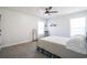 Bright bedroom with a ceiling fan and two windows, showing neutral colors and a simple design at 780 Old Murrells Inlet Rd., Murrells Inlet, SC 29576