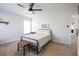 Cozy bedroom with a black metal bed frame, neutral color scheme, and a ceiling fan for added comfort at 780 Old Murrells Inlet Rd., Murrells Inlet, SC 29576