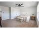 The bedroom offers a queen size bed, ceiling fan, white walls, and large double door closet at 780 Old Murrells Inlet Rd., Murrells Inlet, SC 29576