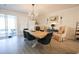 Bright dining area featuring a wooden table, cozy chairs, and a sliding door that leads to an outdoor space at 780 Old Murrells Inlet Rd., Murrells Inlet, SC 29576